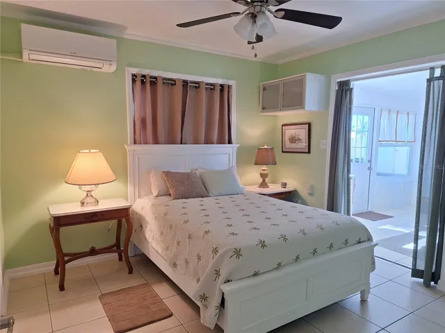Bedroom #2 with access to sunroom and side entry to house
