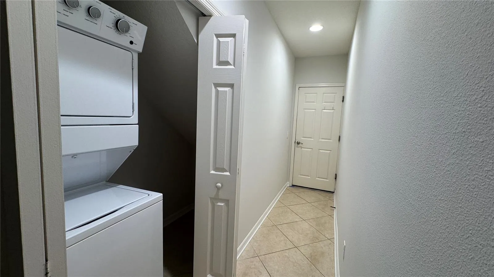 Laundry Closet and Hallway leading to the Garage