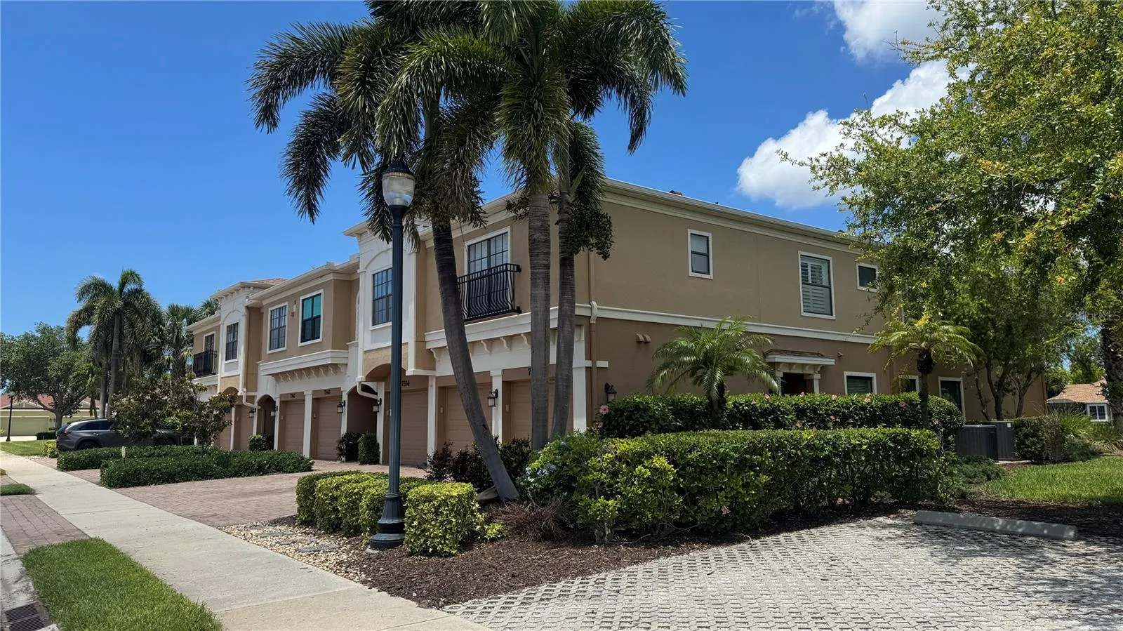 Front of Building and Shaded Parking Lot