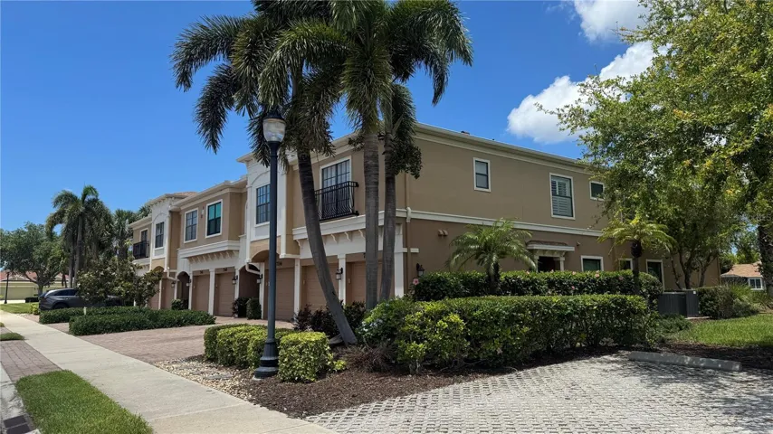 Front of Building and Shaded Parking Lot