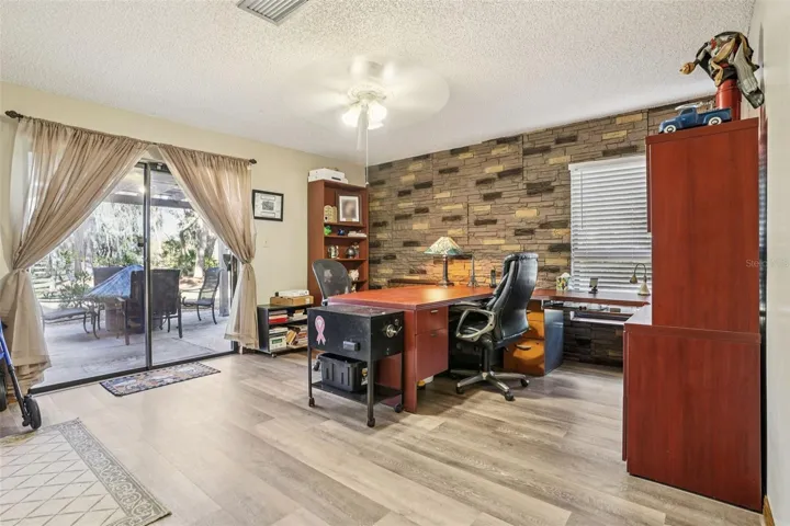 Office with sliders and private patio. First Floor