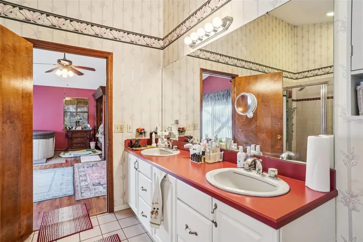 Primary bathroom - double vanity, large walk-in shower, jetted corner bath, WC and bidet
