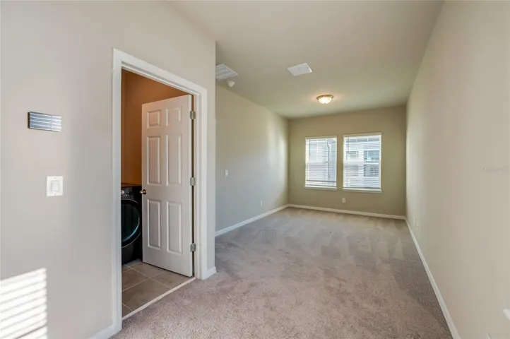 Loft & Laundry at top of the stairs