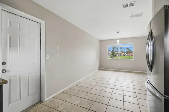 Looking from the kitchen into dining room/sitting area