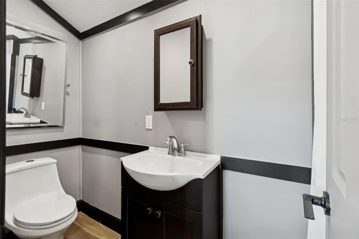 FULL SIZE BATHROOM WITH TOILET, VANITY SINK AND WALK-IN SHOWER