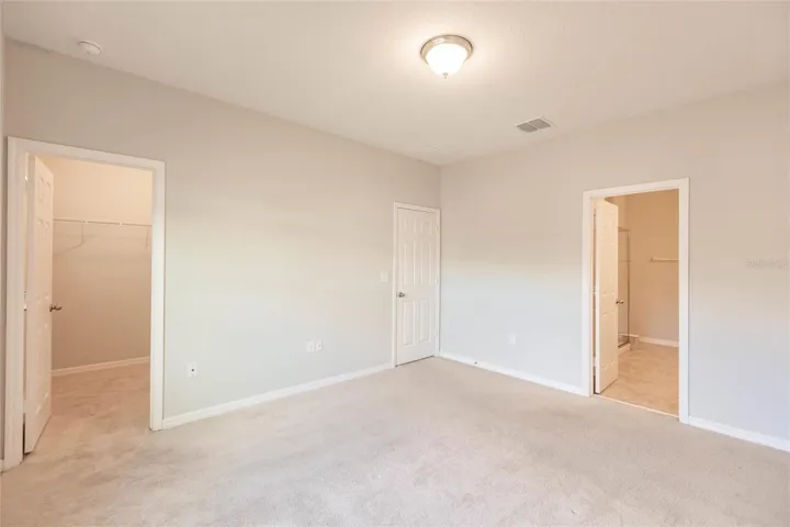 Primary (Master) Bedroom - Closet (On the Left) & Bathroom Entry (On the Right)