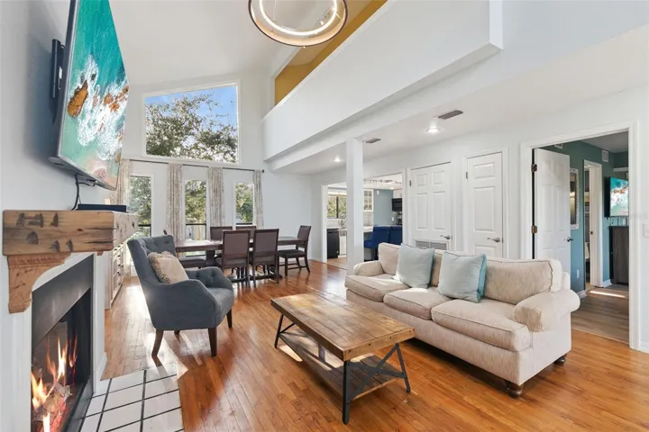 Floor to ceiling, natural lighting in the front of the home.