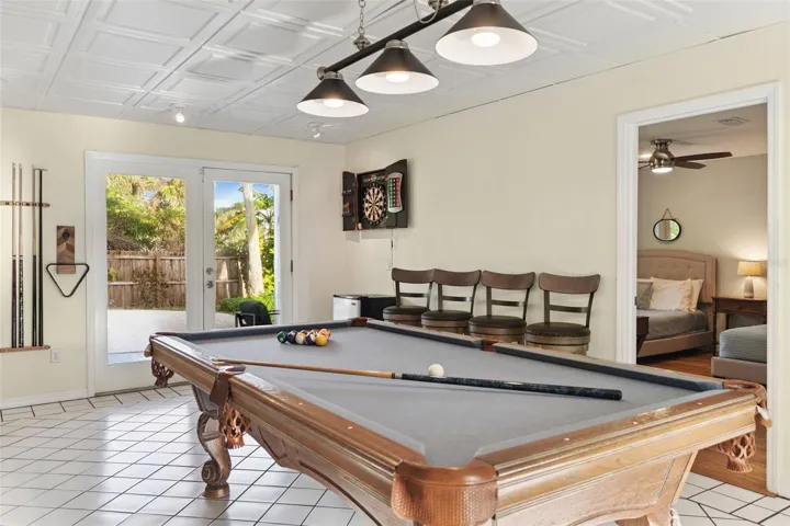 Shoot some pool in the evening with direct access to the deck and pool.