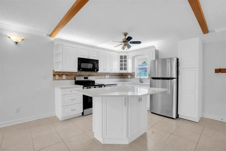 BRAND NEW KITCHEN LOOKING OUT AT YOUR CARPORT
