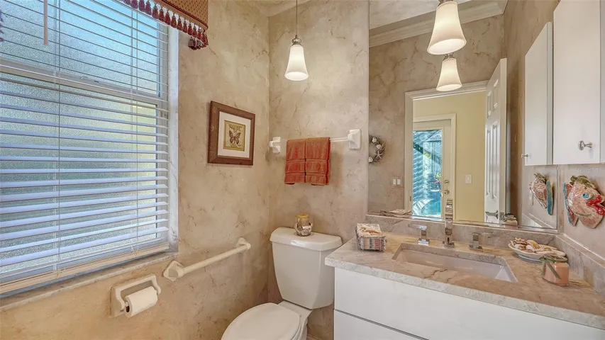 Powder room off family room, also works as the pool bath.