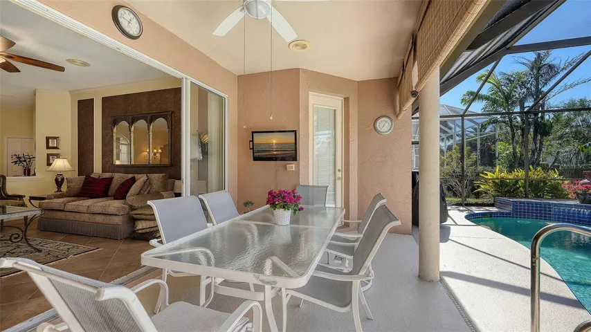 Large sliding glass doors open from living room to lanai.