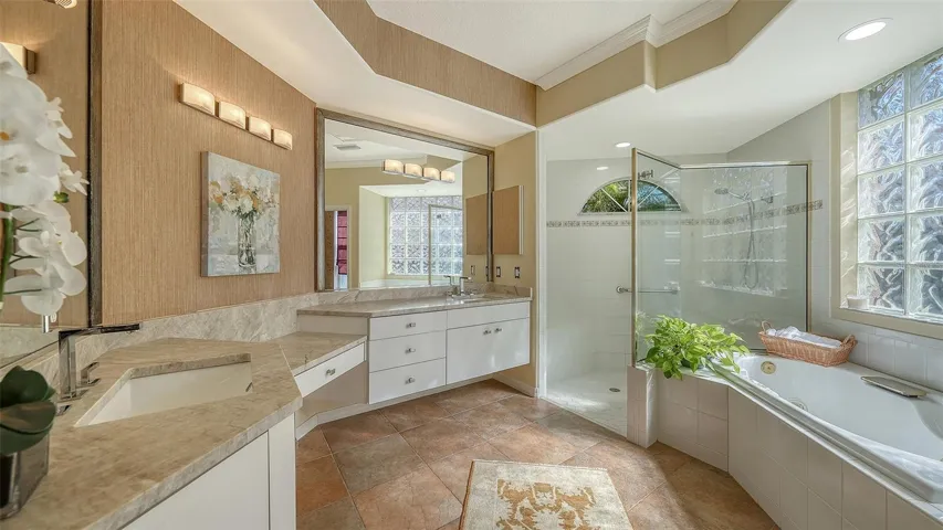 Inviting bath with double sinks, pretty countertops, garden tub.  Always light and bright.