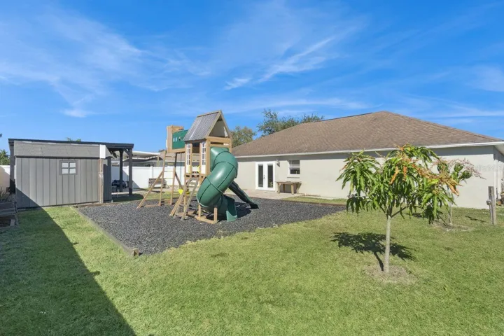 Large Backyard with firepit and playground