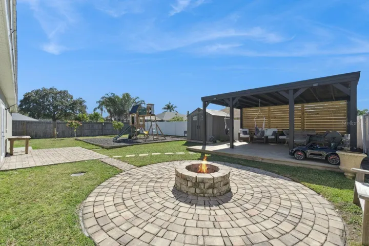 Large Backyard with firepit and playground