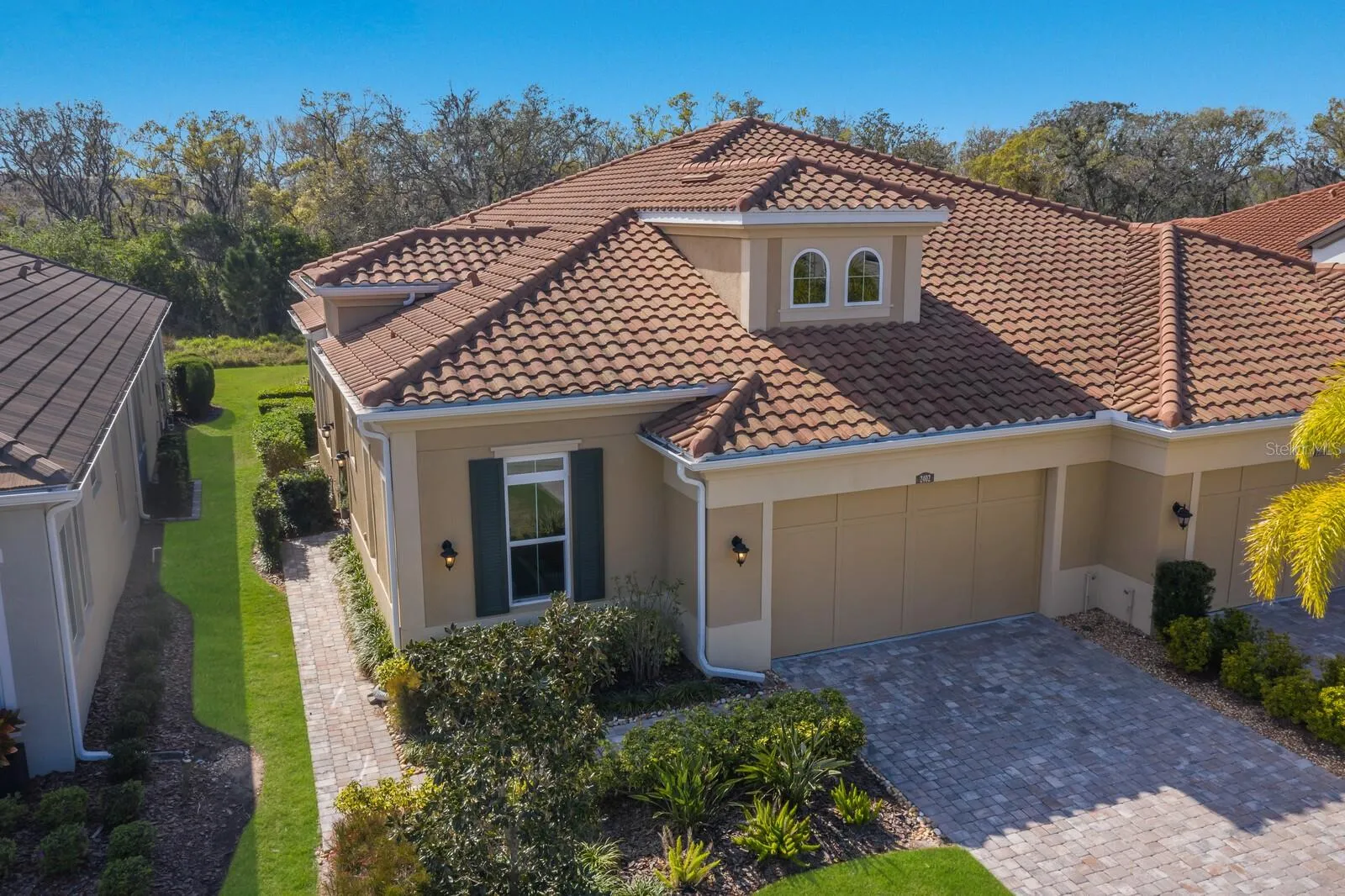 TILE ROOF AND PAVER DRIVEWAY