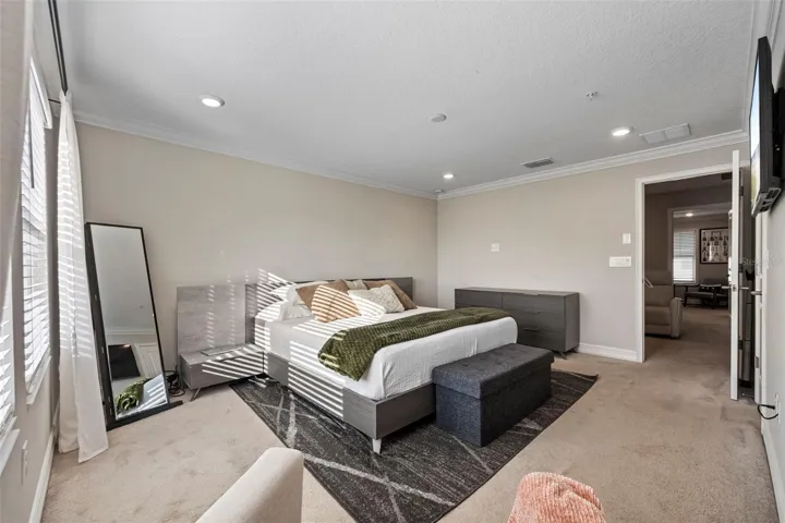 Back Primary Bedroom with a king sized bed