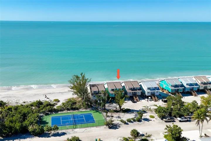 Aerial View. of Unit and Tennis Court.