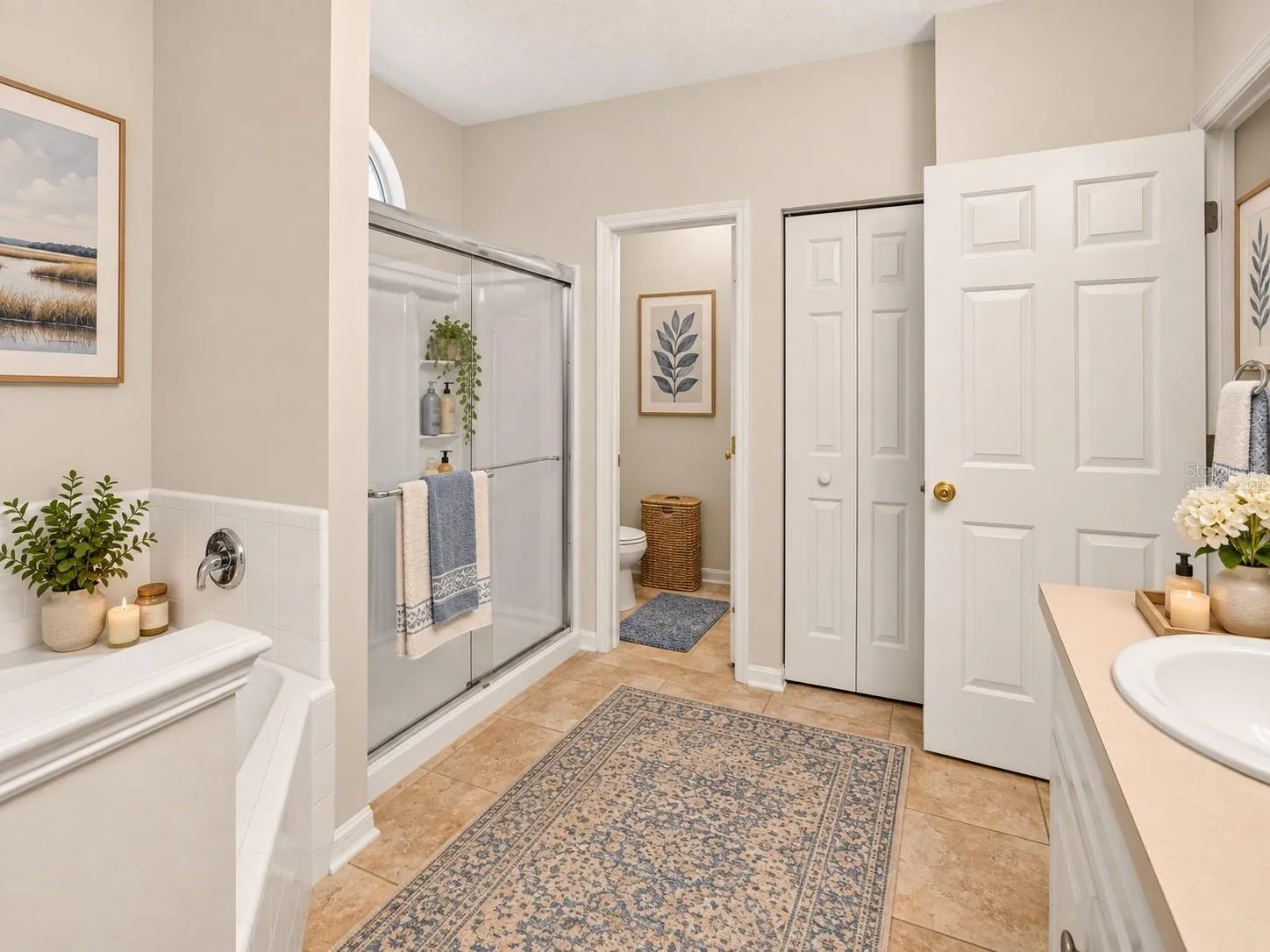 Spacious primary bathroom, virtually staged