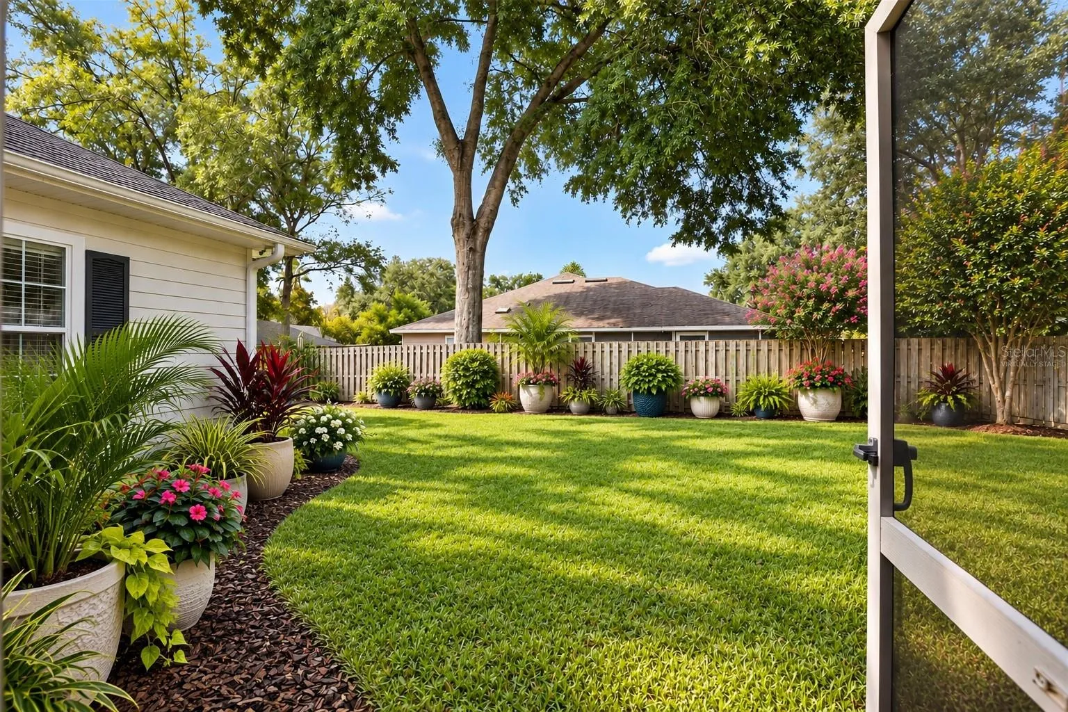 Large fenced yard virtually staged