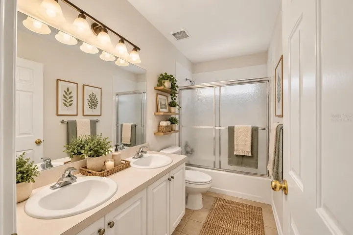 One of three bathrooms, virtually staged