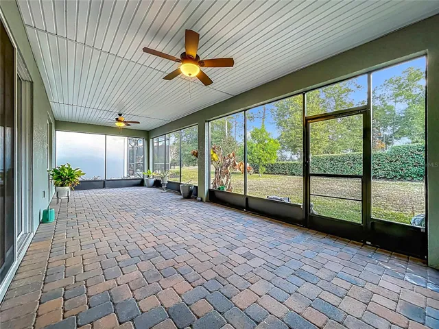Screened-in back patio with fans
