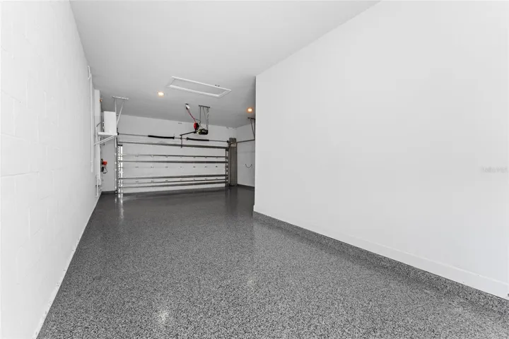 two plus Tandem Garage with Polyaspartic Flooring