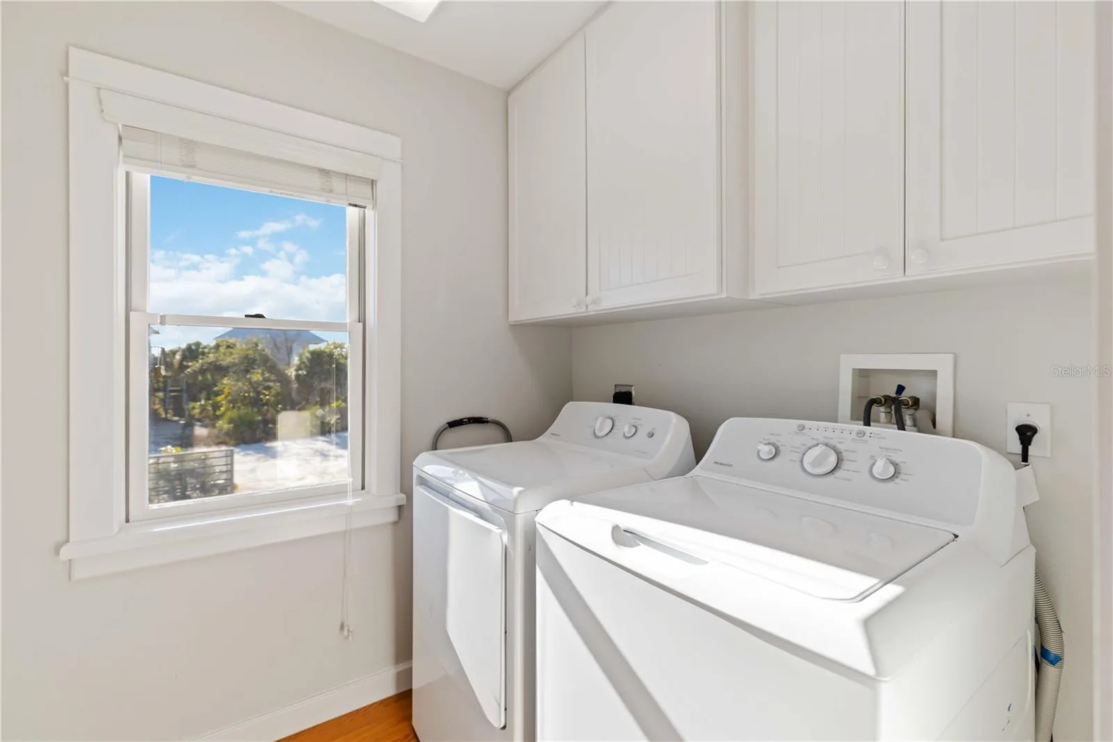 Laundry room with built in ironing board