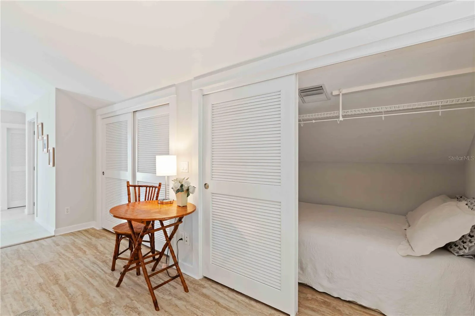 Primary suite walk in closet with full sized bed for extra sleeping