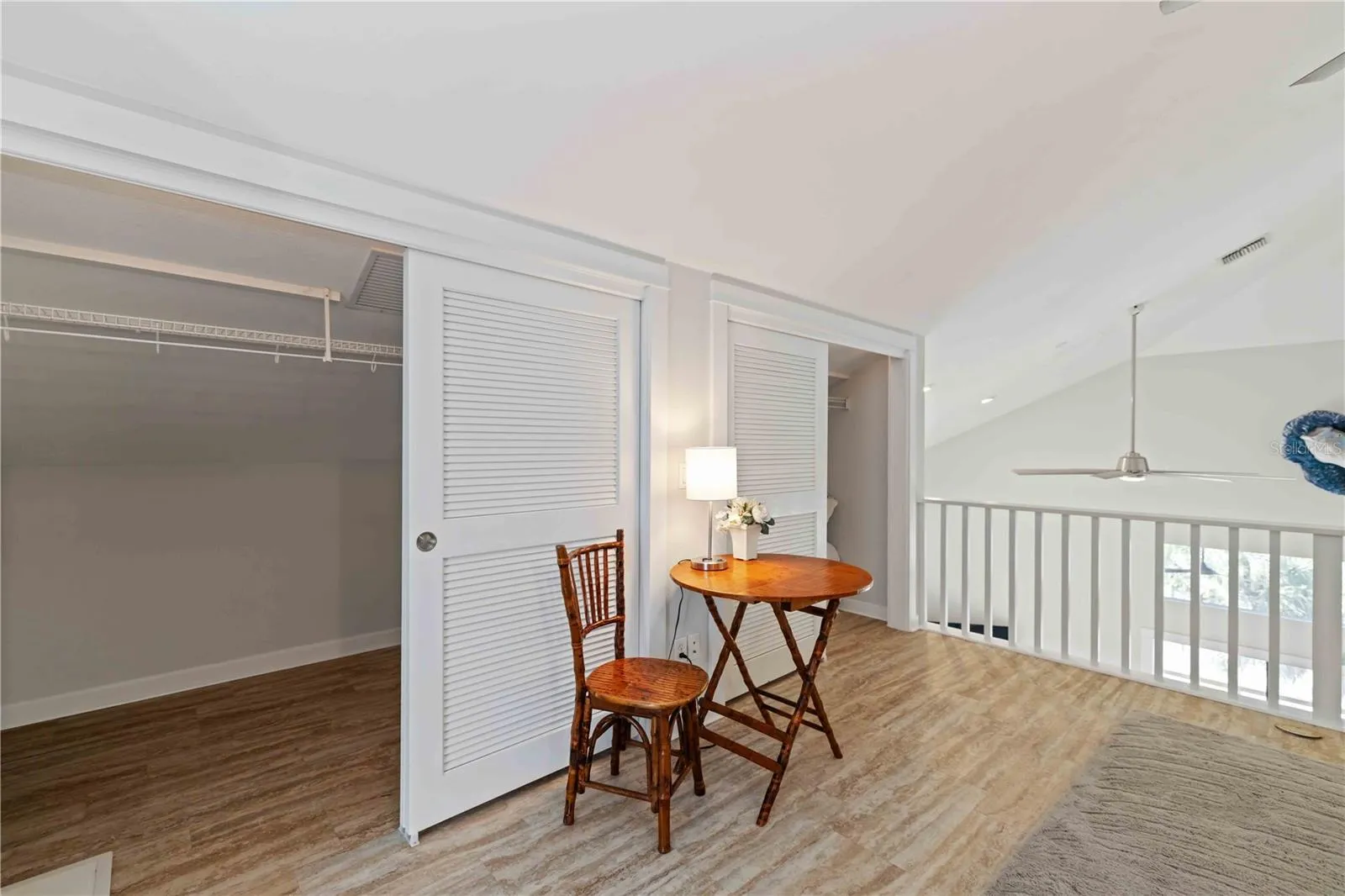 Primary walk in closet with laundry shute