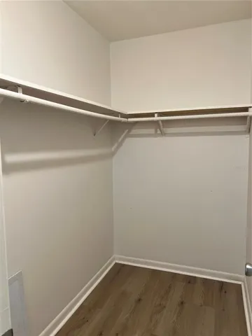 Primary bedroom walk-in closet