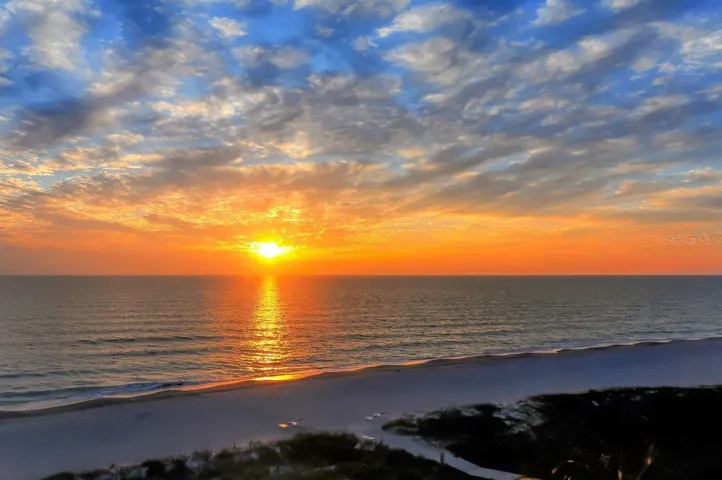 Sunset on the Whispering Sands beach.