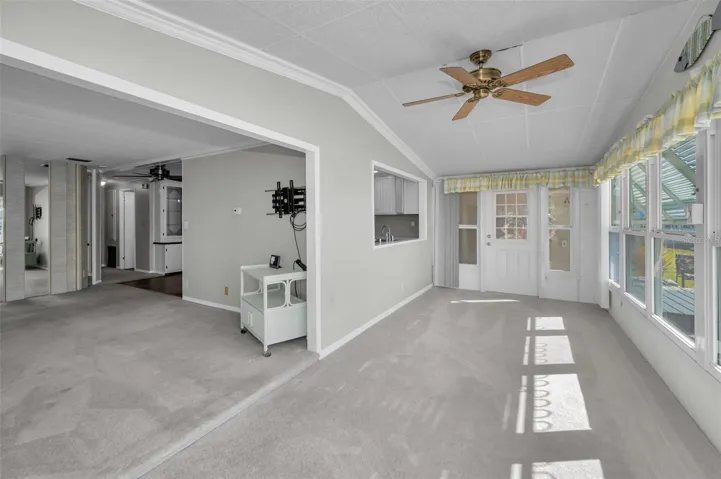 Step down from living room into Florida room