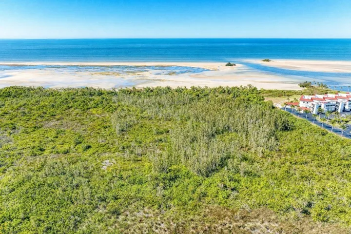 Beachy view at low tide, note channel to gulf