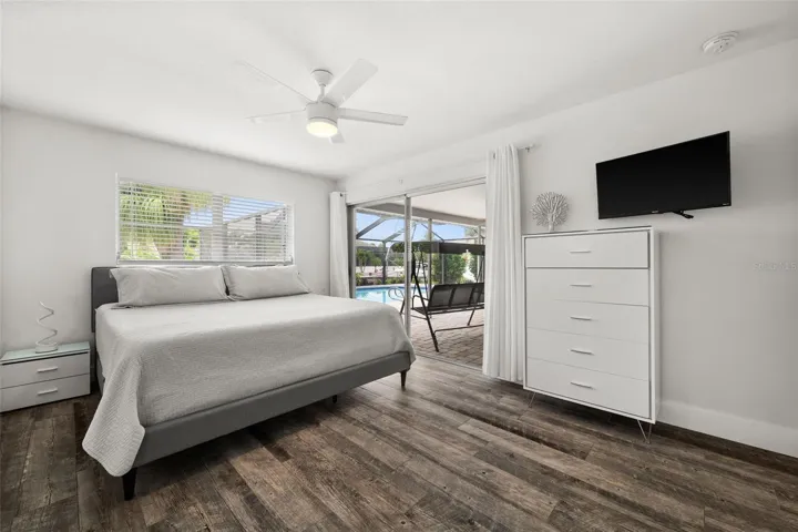 Master Bedroom with sliding door directly to the lanai / pool area