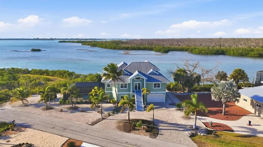 Peninsula lot with views of Lemon Bay, Oyster Creek and Cedar Point Environmental Park across the way