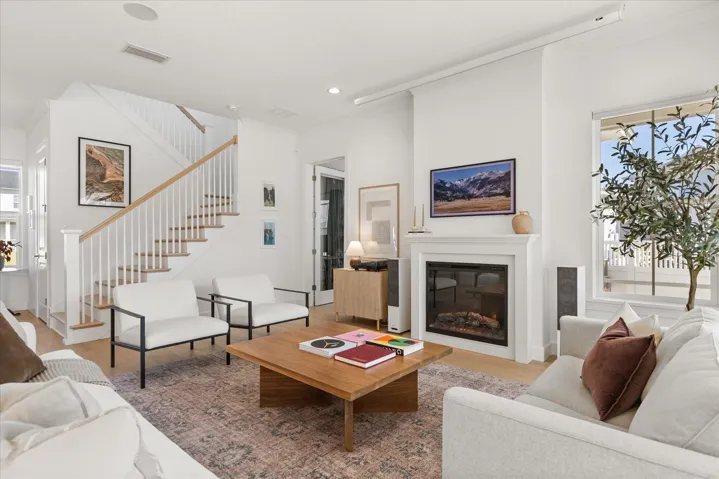 Living Room with fireplace and slider doors to screened lanai