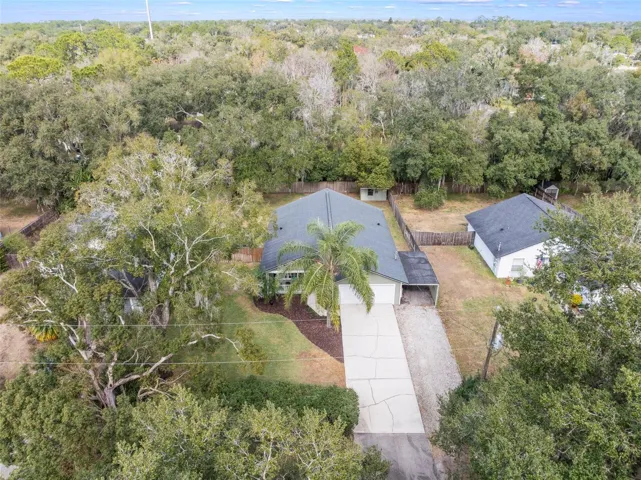 Surrounded by mature trees.