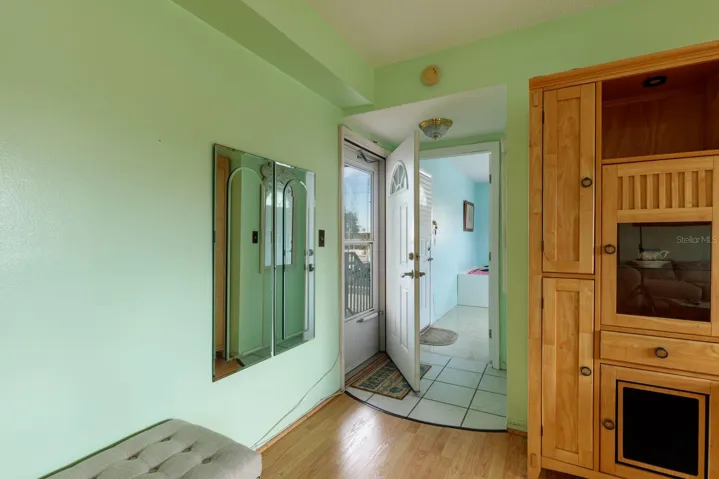 Front door & primary bedroom is behind it.