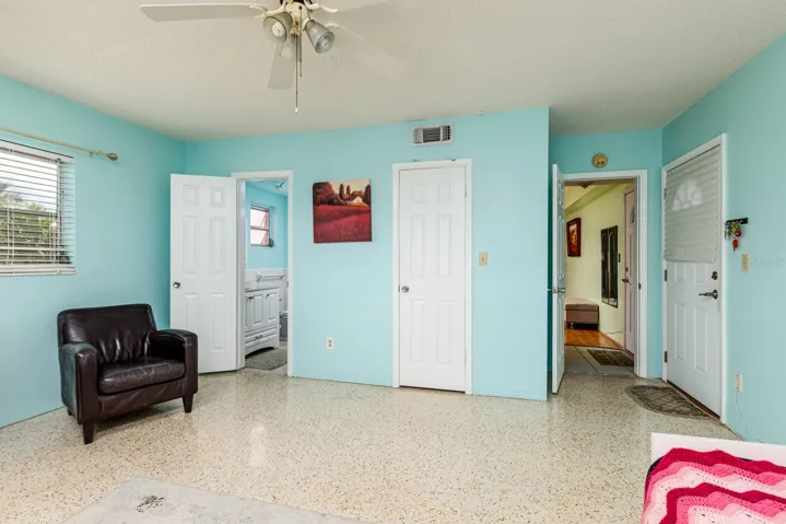 Primary bedroom w/En-Suite bath, Walk-in closet & private door to outside walkway. Other bedroom door to living room.
