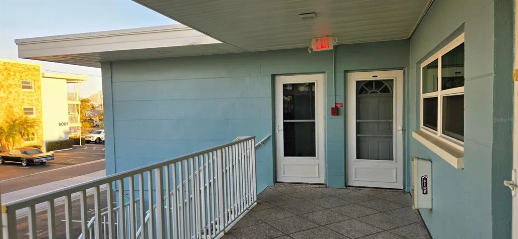 Front door on right & private door to primary bedroom.