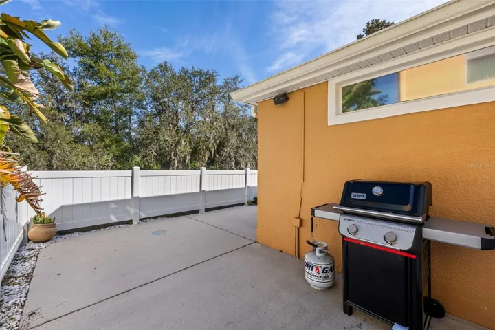 Private fenced patio ideal for grilling, relaxing, and entertaining