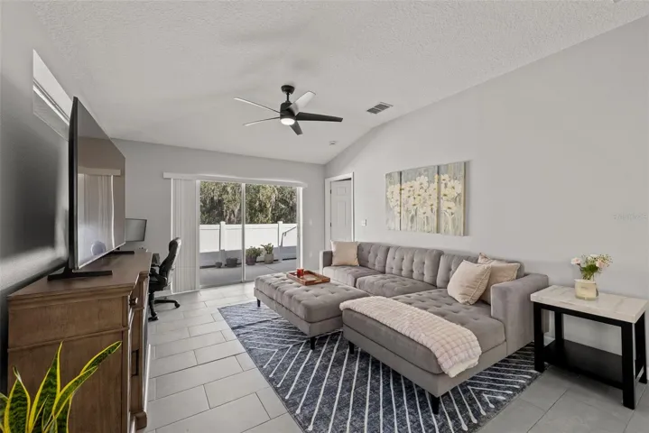 Spacious living area with slider access to the patio