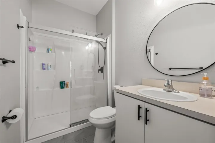 Primary bathroom with updated fixtures and clean finish