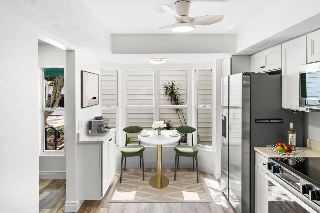 Bay window offers area for dinette w/ built-in coffee bar       *staged