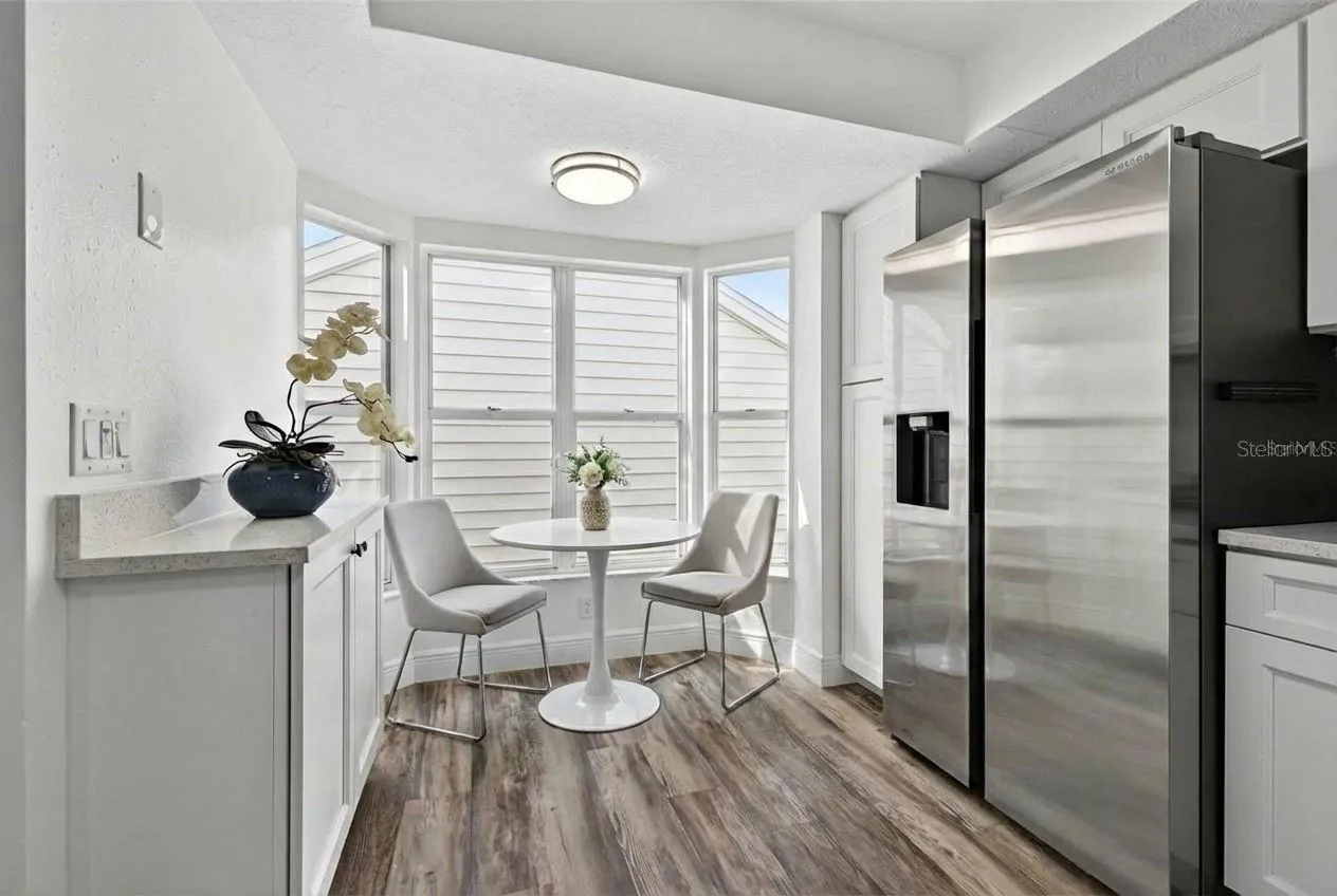 Area for dinette w/ built-in cabinet for extra storage - or wine bar!*staged