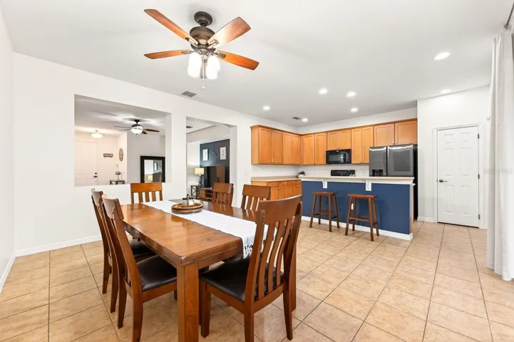 Spacious dining area is open to a well appointed kitchen.