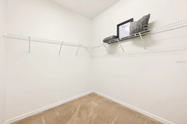 Primary suite walk-in closet.