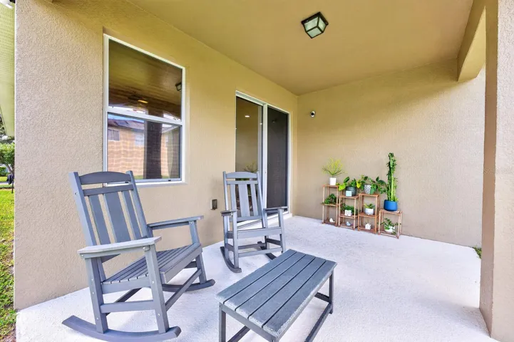 Nice outdoor living space - covered lanai at the back of the home.
