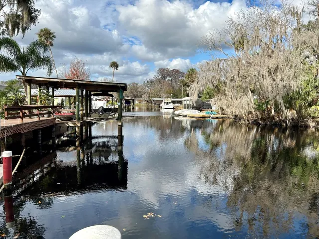 55730 Holiday Cir View Of Canal Behind Boathouses