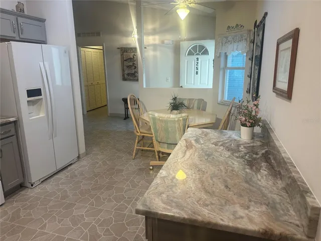 View from door that goes out to garage into the kitchen